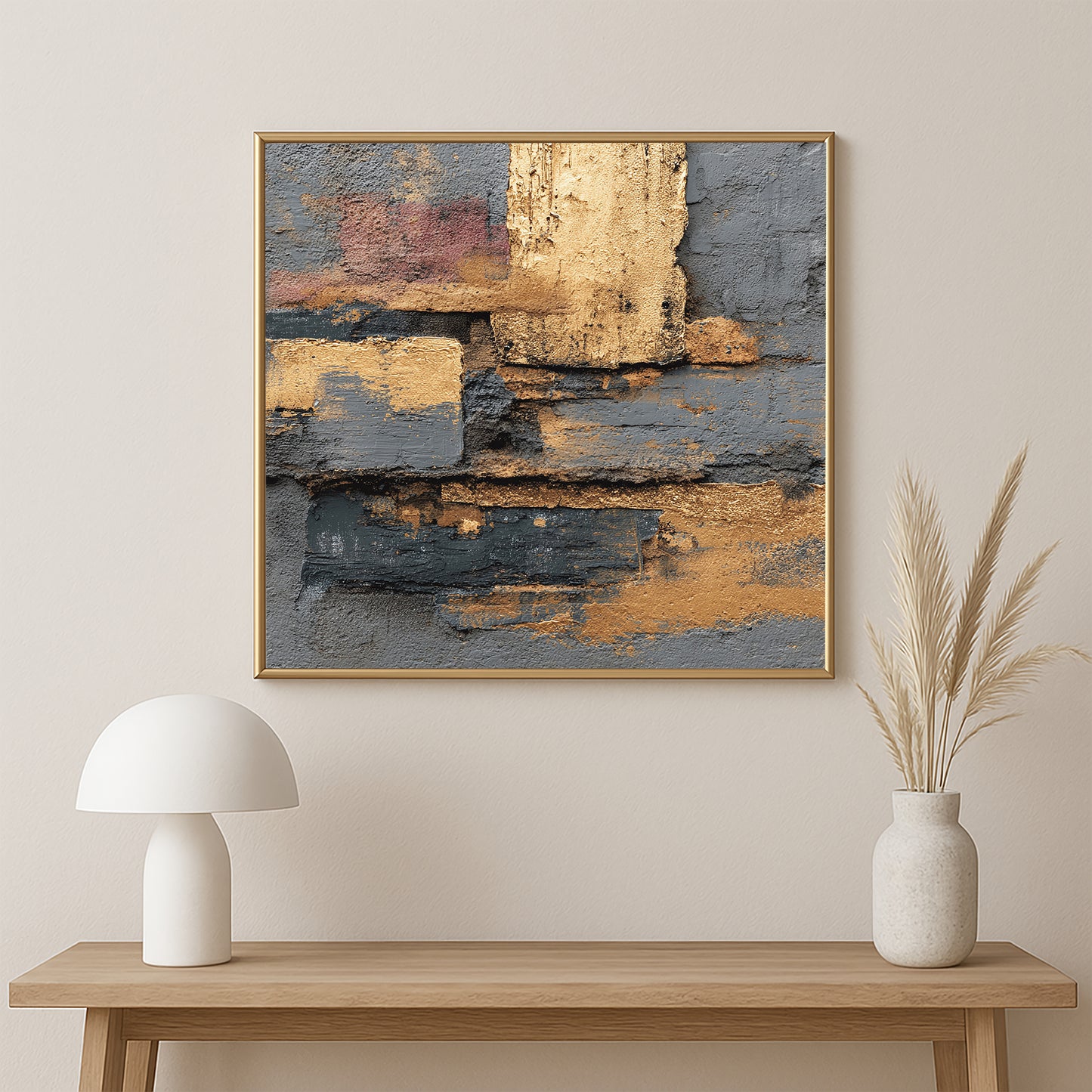 Geometric abstract wall art showing layered gold and dark gray shapes with rich texture and a soft gray background.