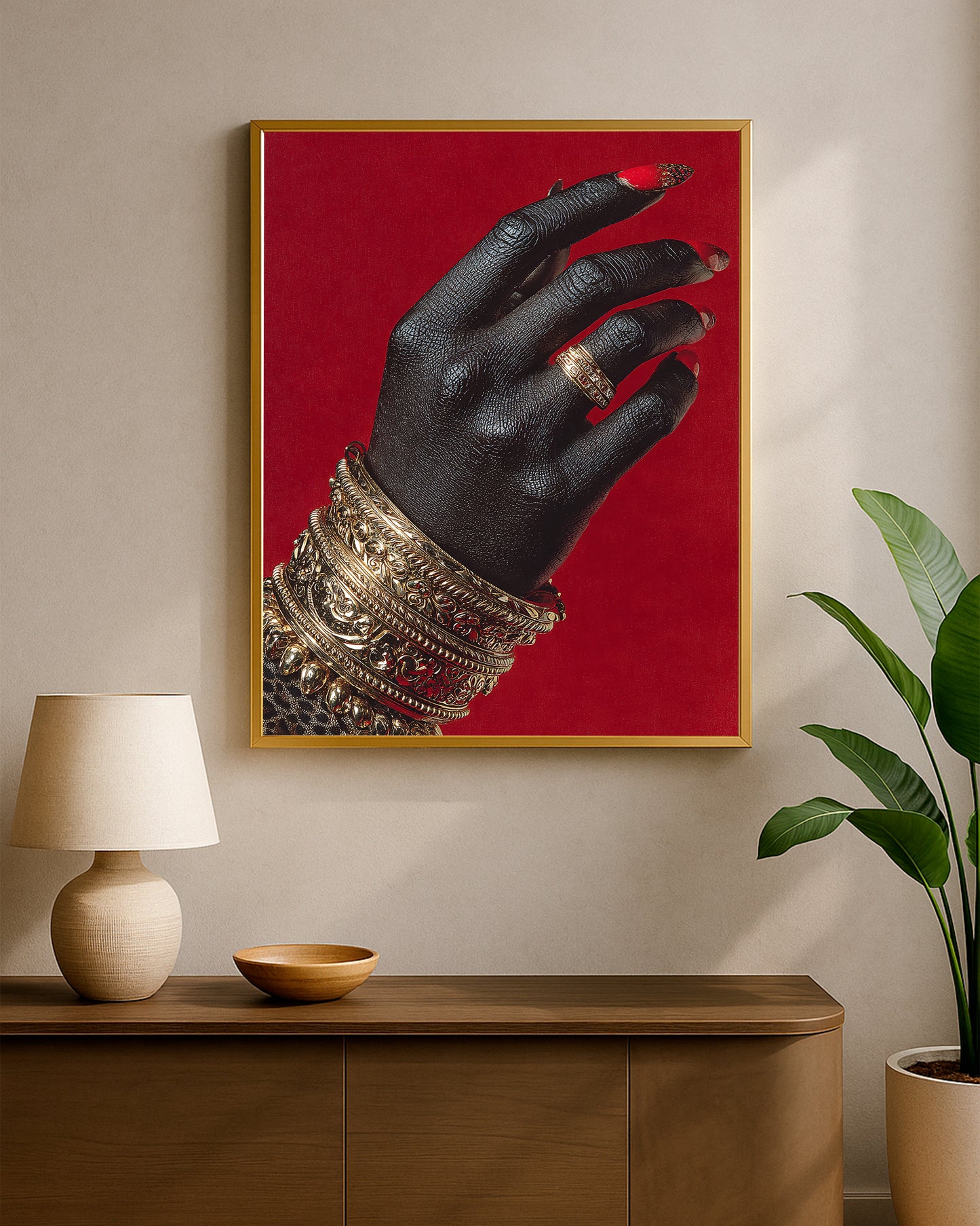 Glam decor artwork with a black hand, intricate gold accessories, and bright red nails in a high-contrast composition
