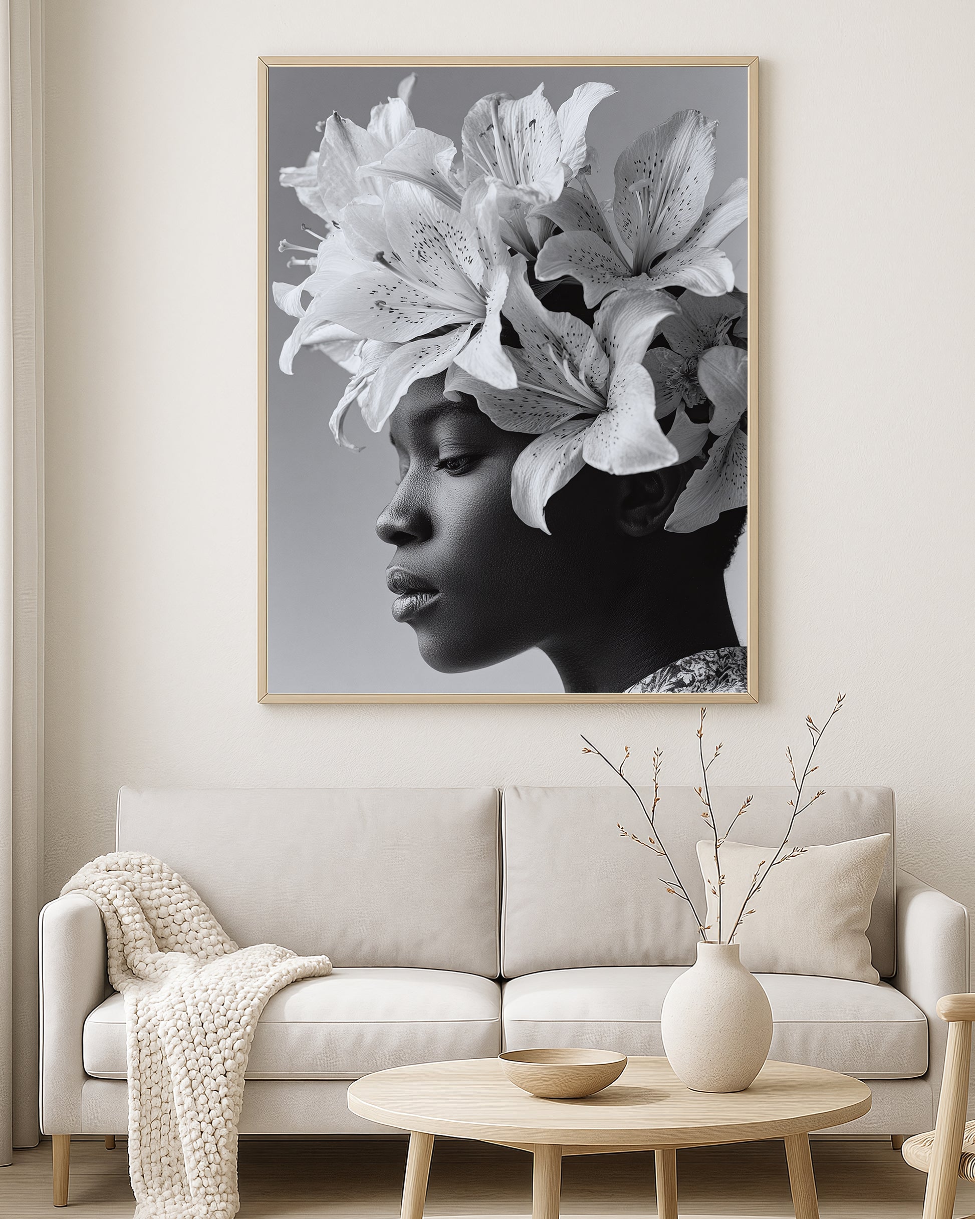 Monochrome portrait artwork of a woman in profile with an oversized lily flower headpiece and soft gray background