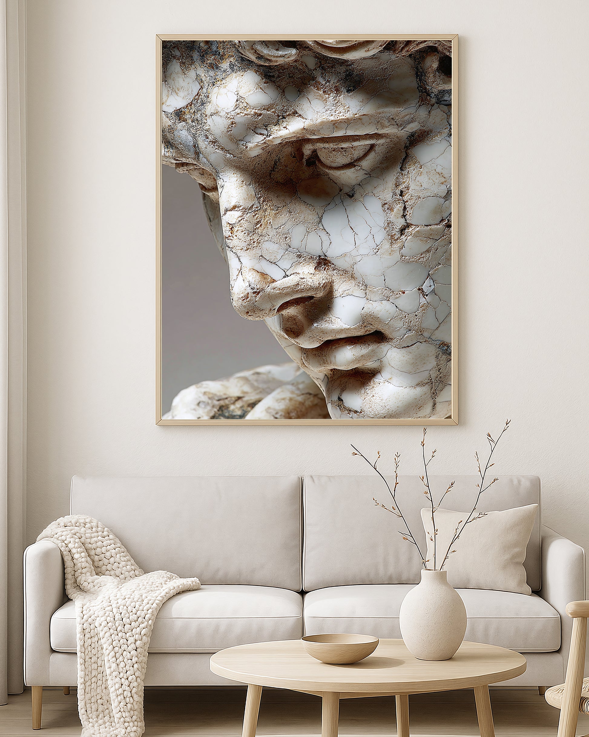 Classical statue face artwork showing a close-up cracked marble surface with aged neutral tones.