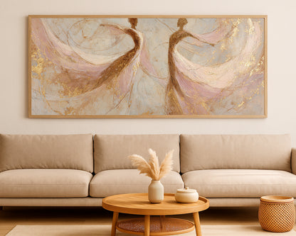 Elegant panoramic wall art featuring two flowing figures with delicate blush layers and metallic-style gold detail.
