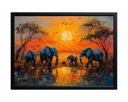 Elephant sunset wall art with a group of elephants gathered by reflective water beneath a glowing orange sky