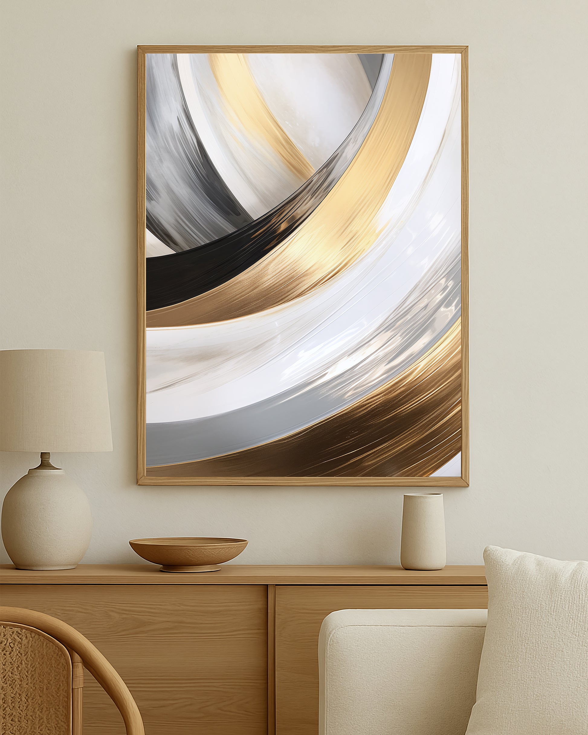 Contemporary abstract print with flowing arc shapes in gold, black, and gray creating a polished high-contrast design.