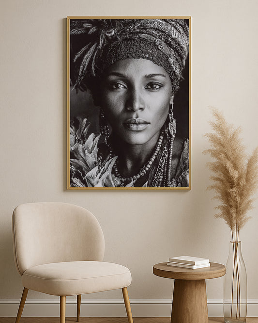 Monochrome female portrait wall art showing a direct gaze, ornate head covering, earrings, and layered beads.