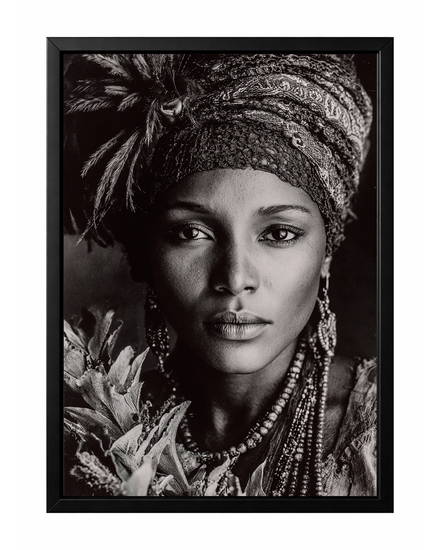Black and white African-inspired woman portrait with patterned headwrap, feather detail, jewelry, and floral foreground.