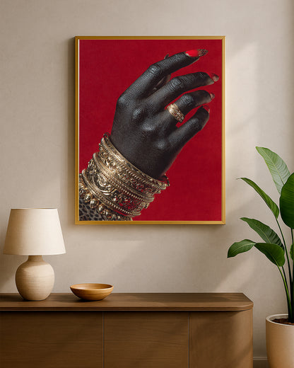 Glam decor artwork with a black hand, intricate gold accessories, and bright red nails in a high-contrast composition