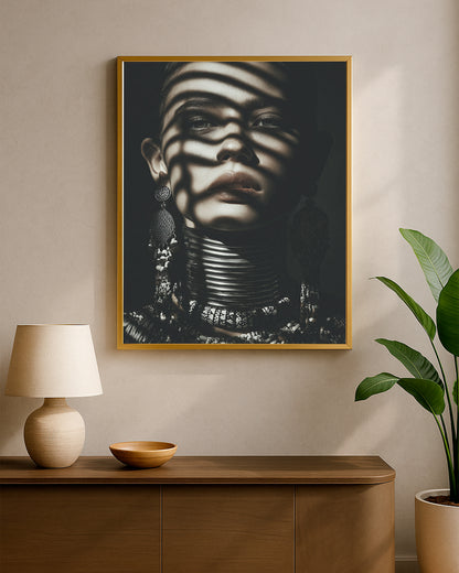 Dramatic portrait wall art showing a woman with heavy shadow patterns, earrings, and sculptural neck adornment.