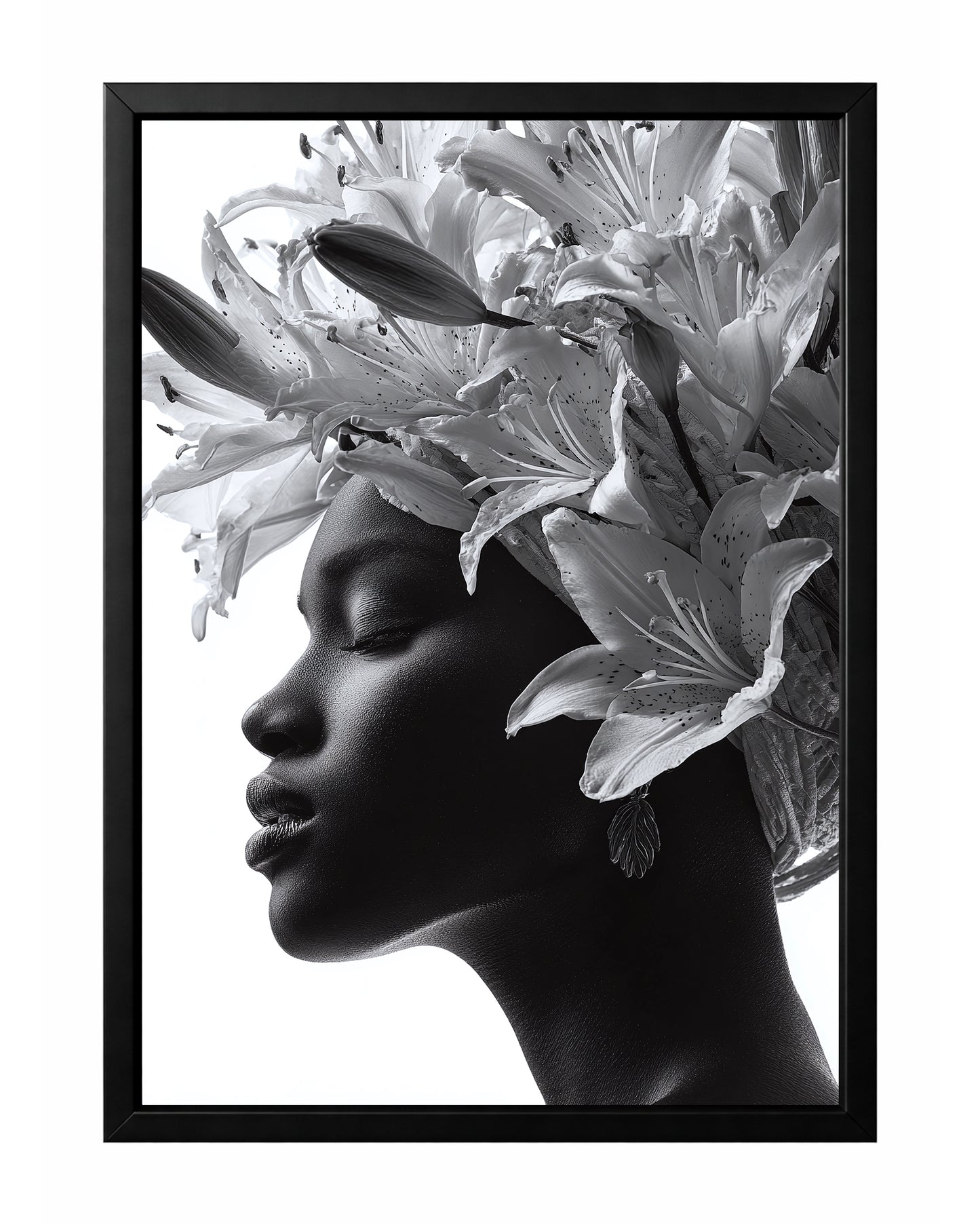 Black and white floral woman portrait wall art featuring a serene side profile framed by large blooming lilies and buds