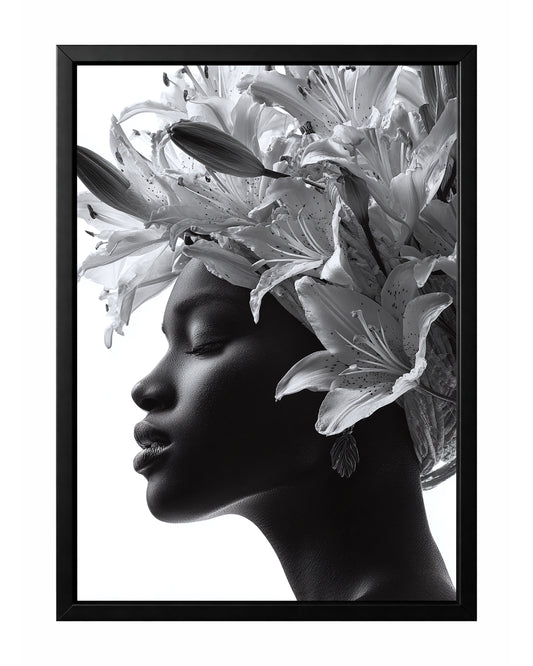 Black and white floral woman portrait wall art featuring a serene side profile framed by large blooming lilies and buds