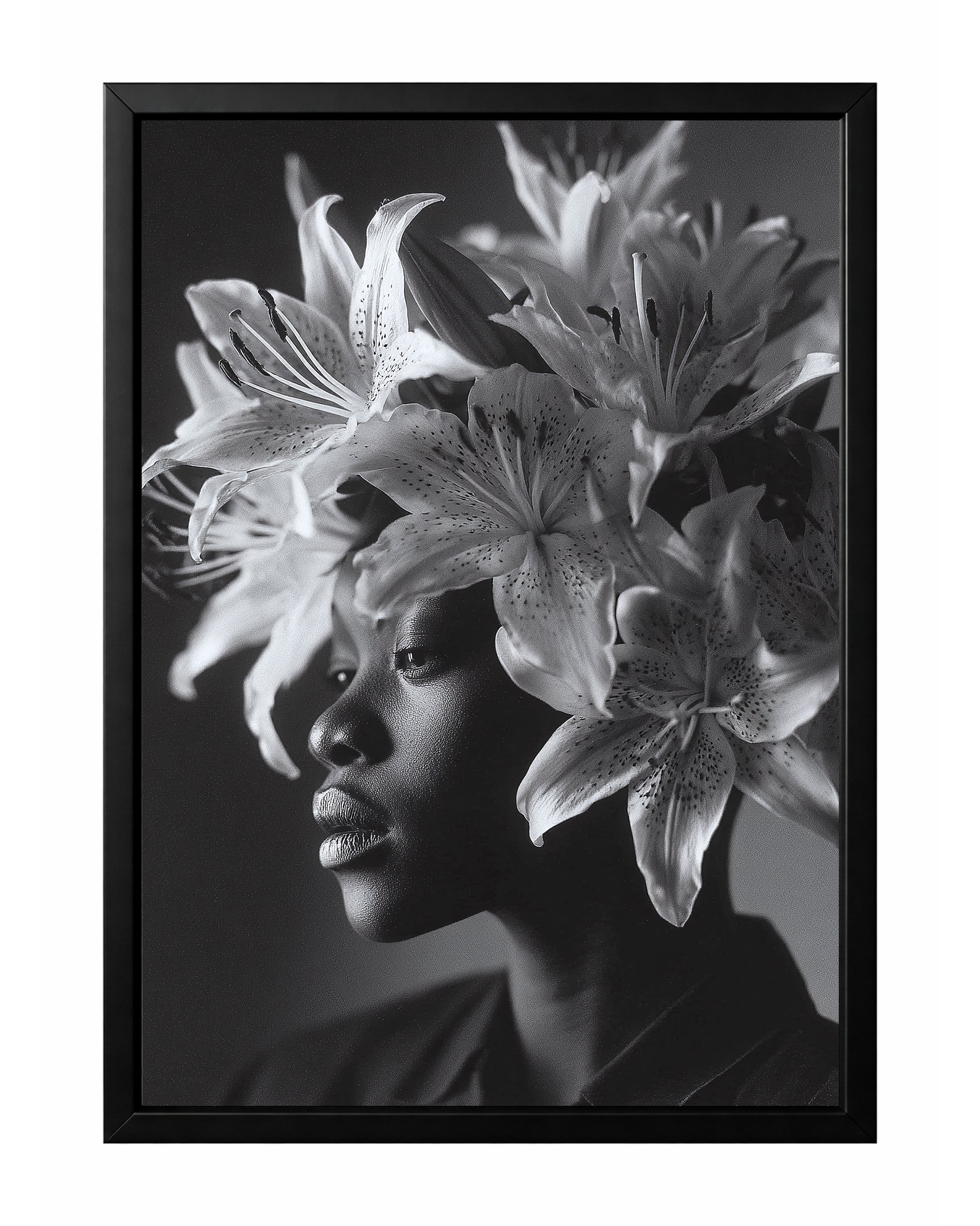 Black and white floral woman portrait wall art featuring a side profile framed by large blooming lilies and unopened buds