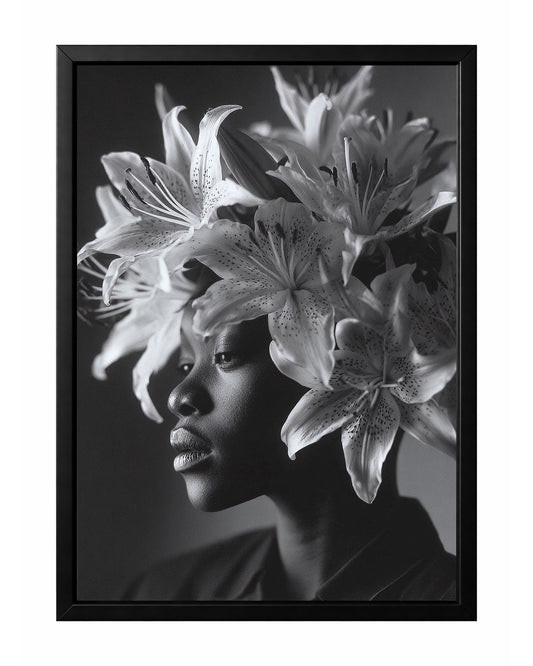 Black and white floral woman portrait wall art featuring a side profile framed by large blooming lilies and unopened buds