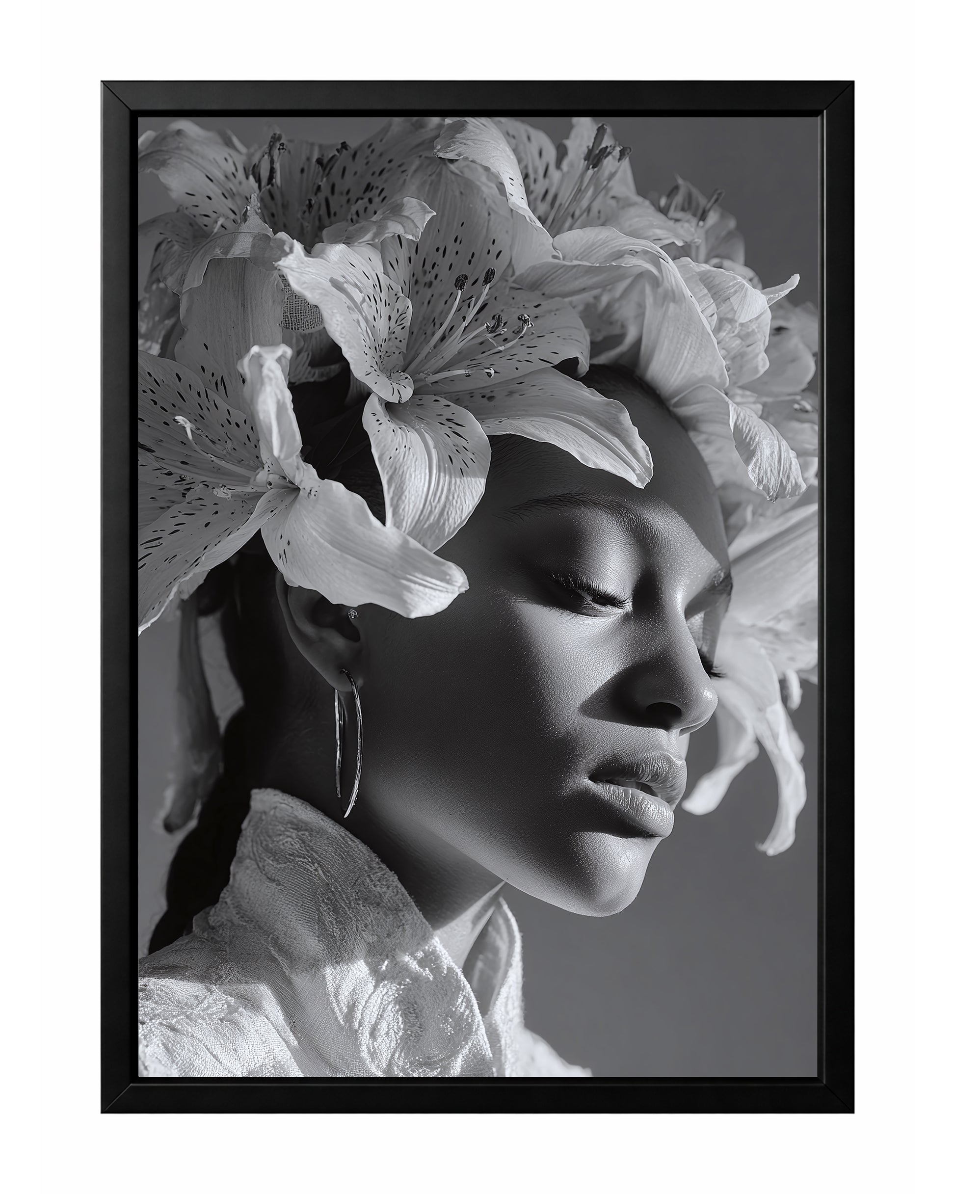 Black and white floral woman portrait wall art featuring a serene side profile with closed eyes and a crown of blooming lilies