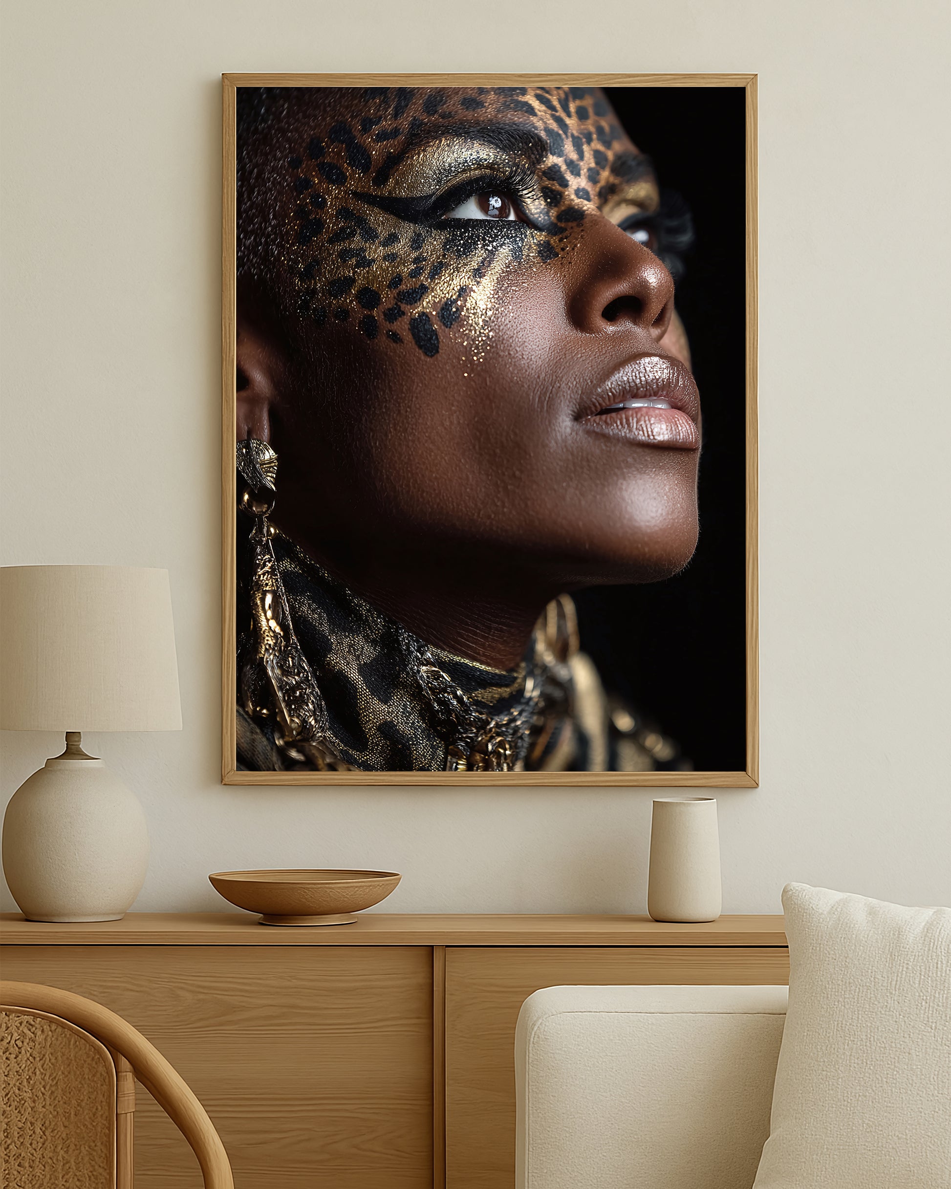 Luxury beauty wall art with a woman’s face in profile, black and gold leopard-style detailing, and statement editorial styling